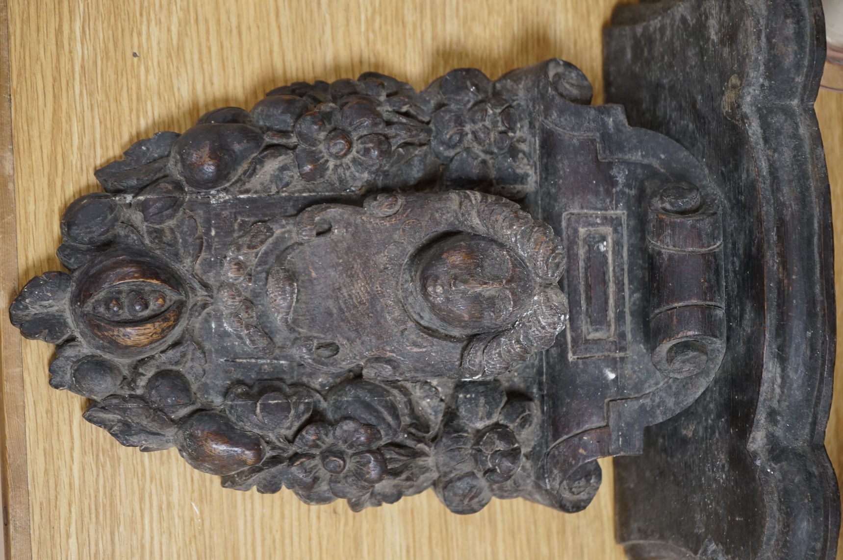 A Carved oak figural wall bracket, in late 17th century style, 35cm long